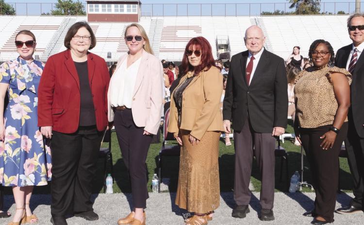 Left to Right Principal Will Schneider, Assistant Principal Cookie Mundt, School Board President Katherine Lemoine, Superintendent Doris Voitier, School Board Members Carly Creason, Rosiland White, Principal Wayne Warner, School Board Members Keisa Rodney, Sean Warner, Henry Rodriguez III.