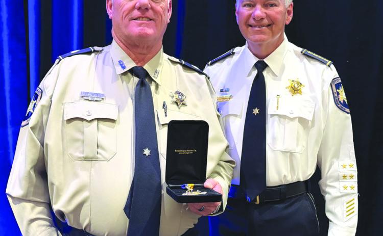 St. Bernard Sheri James Pohlmann, right, stands with Detective Sgt. Kenneth Sierra during the 41st Annual Crimestoppers of Greater New Orleans Awards Luncheon, where Sgt. Sierra was recognized as one of the region's 2026 Deputies of the Year.