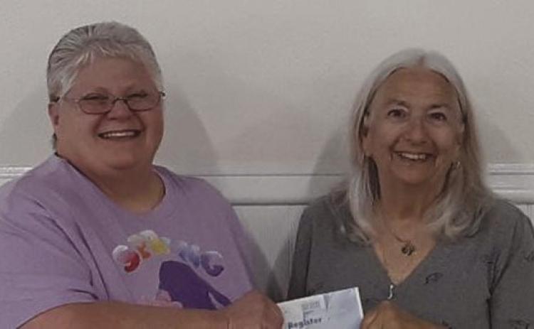 NARFE Vernon N. Landry St. Bernard Chapter 1398 Treasurer Sylvia Keller is pictured here (on the right) presenting Laura Napolitano, Chapter Alzheimer’s Coordinator, with a check for $2,000 in contribution to the NARFE Alzheimer’s Fund. Since 1985, NARFE has supported research into the cause, prevention, and treatment ofAlzheimer’s disease, and has donated more than $15,000,000, thus far.