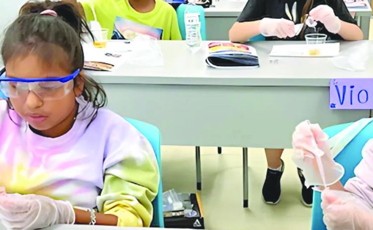 The STEAM Department at Nunez Community College will o er more than 10 multi-day camps for young students this summer. Pictured, students conduct an experiment in a past Astro Camp at Nunez.