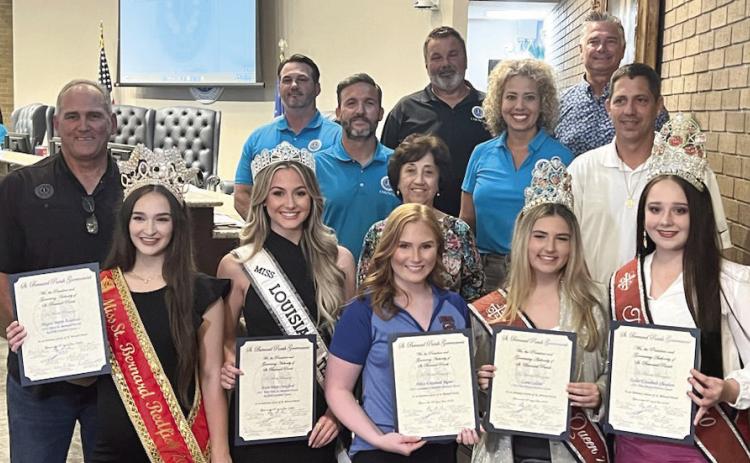 St. Bernard Parish festival queens pose with council members and parish president Guy McInnis as they accept their 'honorary citizen' proclamations.