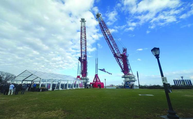 Associated Terminals’ “D. Lopez” and “Bill S.” cranes, newly christened January 22 at Woldenberg Park in New Orleans.