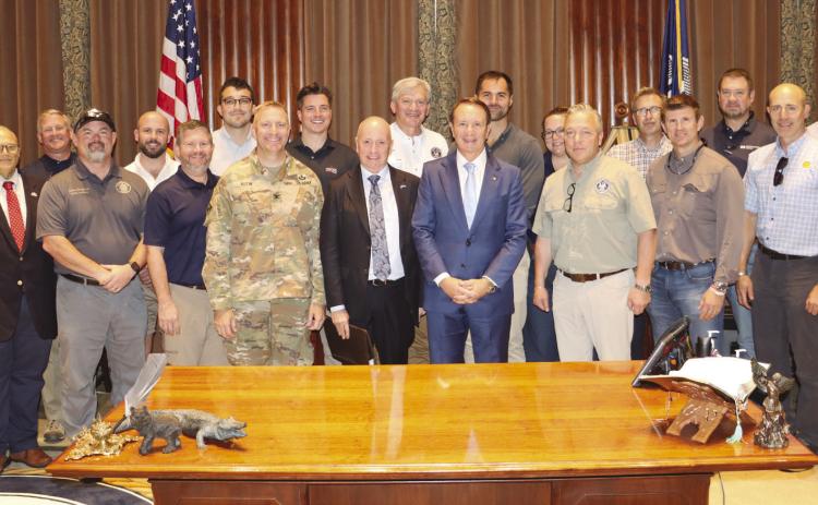 State Rep. Mike Bayham (second from left) joined Governor Je Landry and Insurance Commissioner Tim Temple in meeting with London-based reinsurance executives to highlight Louisiana's . ood resiliency e orts and build con. dence in the state's ability to withstand catastrophic hurricanes.