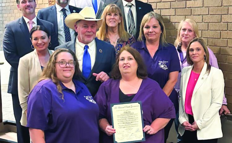 Parish council members and parish president Louis Pomes pose for photo alongside members of the Family Violence Program in St. Bernard after proclaiming the month of October as Domestic Violence Awareness Month in the parish.