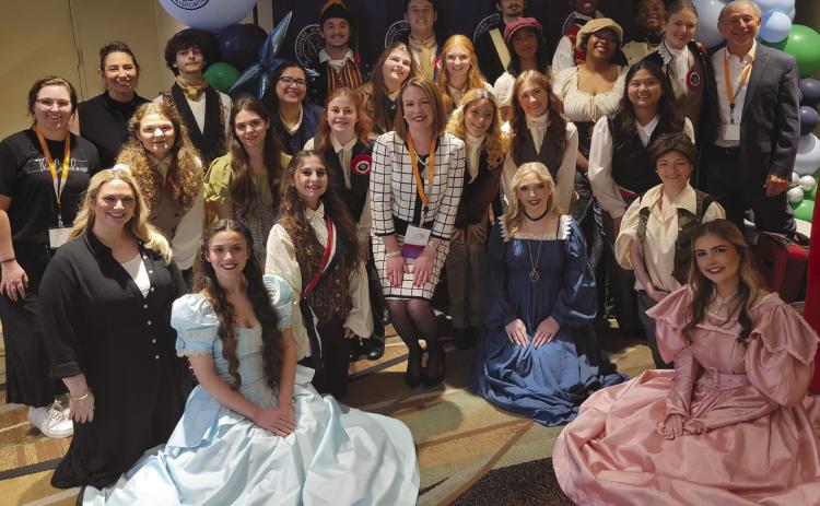 LSBAPresident Dr. Katherine Lemoine and the members of the CHS Voices.