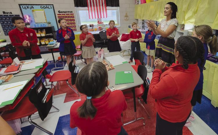 Eleanor Frederic-Humphrey teaches at Gauthier Elementary as part of the Goat in the Road Play / Write Program.