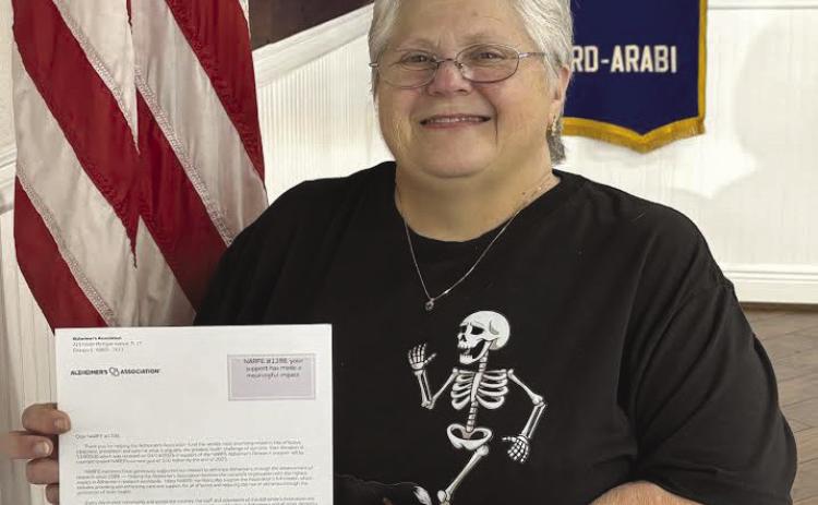 NARFE Vernon N. Landry St. Bernard Chapter 1398 Alzheimer’s Coordinator Laura Napolitano is seen here holding a thank you letter from the Alzheimer’s Association. Earlier this year, NARFE St. Bernard Chapter 1398 made a donation to them for $3000 in support of research into the cause, prevention, and treatment of one of the greatest health challenges of our time.