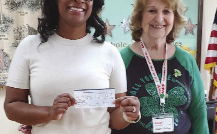 On Saturday, February 28, 2026 AARP Chapter 3926 in Chalmette welcomed guest speaker Latiya Smith (left) from ARC Organization of Greater New Orleans. She talked about all the programs that they o er for handicap and other children with health issues. ARC also has locations in New Orleans &amp; West Bank. A $200 donation was made to ARCGNO and the AARP members brought in several bags of Mardi Gras beads for their organization. Also picture: Leona Galley, President of AARP Chapter.