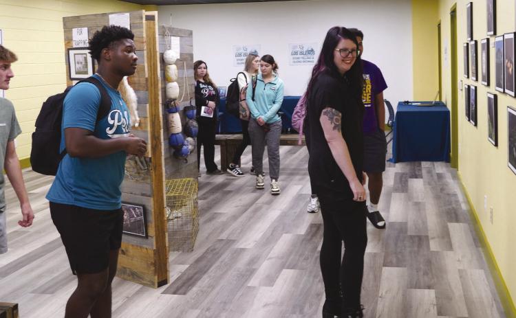Nunez Community College opened its Los Isleños Historical Archive Aug. 27 with an open house for special invited guests. The archive is open and available to the public on the second floor of the Nunez Library. Pictured, Nunez instructor Taylor Amalfitano leads her class through the archive.