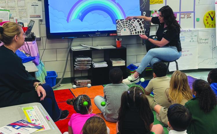 SBSO’s school liaison investigator Lt. Michelle Canepa shared a story with Arabi Elementary School students during Literacy Week.