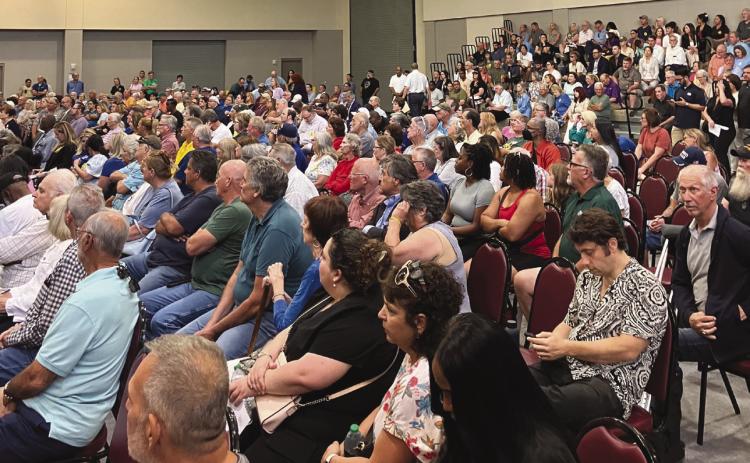 Residents pack into Val Reiss Sports Complex to participate in USACE public hearing on LIT permit.