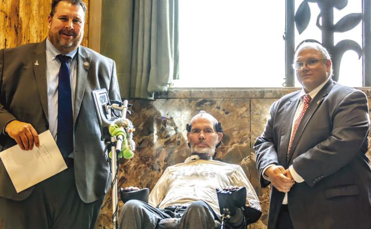From left: Rep. John Illg Jr., Steve Gleason, and Rep. Mike Bayham.