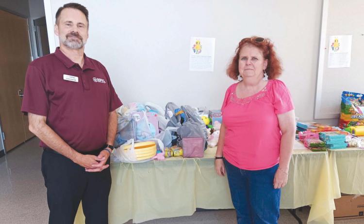Nunez Community College sends a big Pelican 'thank you' to John Barthe and the crew at EPIC Federal Credit Union for making another massive donation to the college's Easter Basket toy and candy drive for the Family Violence Program Of St. Bernard. Each semester, the Nunez Chapter of Gamma Beta Phi Honor Society conducts a drive bene. ting kids in the Family Violence Program, and the Epic FCU sta routinely make large donations. Nunez thanks Epic FCU for their participation and support.
