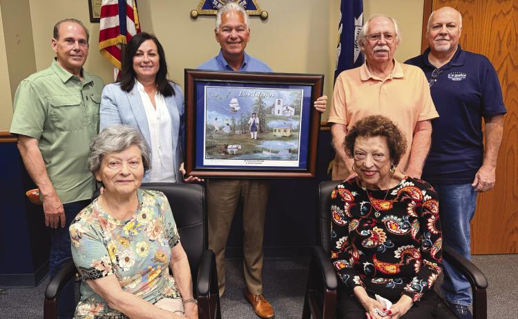 Seated from left: Lena Nunez, Society president, and Janice Crespo-Smith, Society vice president. Standing from left: Joey DiFatta, Society member; St. Bernard Parish Assessor Jaylynn Bergeron Turner, Society member; Sheri James Pohlmann; Bob Smith, Society member; and Jimmy Faust, Society director.