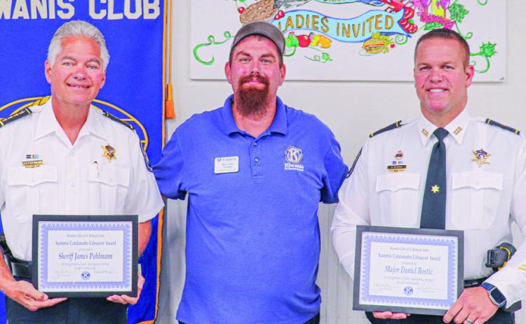 Pictured, from left: Sheriff Jimmy Pohlmann, Kiwanis President Nick Koepp and Major Danniel Bostic.