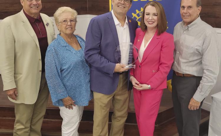 Rotary Board Members Sean Warner, Brenda Break. eld, and Joey DiFatta recognize Dr. Katherine and Barry Lemoine for their service to St. Bernard Parish.