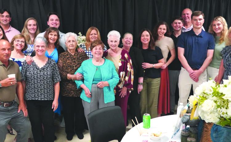 Retired Nunez Community College Culinary Instructor Chef Ruth Varisco, center, in blue, poses for a picture with her family during A Seat at Chef Ruth’s Table. Proceeds from the retirement party and fundraiser will go toward the newly-established Chef Ruth Varisco Scholarship Fund. Chef Ruth was a culinary instructor at Nunez for more than 30 years.