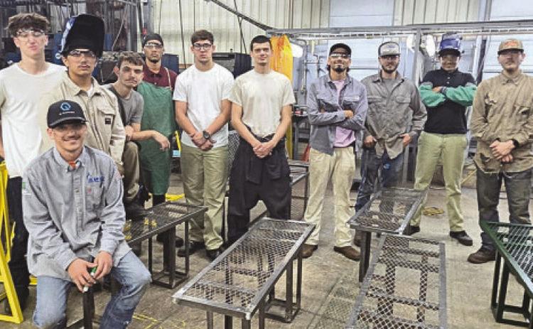 Nunez Welding Summer Internship students show o bike racks and benches they fabricated for St. Bernard Parish parks and trails. Each summer the Welding Summer Internship completes a public service project.