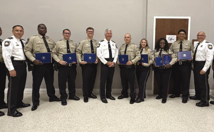 Seven St. Bernard Parish Sheri 's O ce deputies graduated May 5 from the Peace O cers Standards and Training, or P.O.S.T. School at the Slidell Regional Police Academy. At the graduation are, from left: Lt. Donald Johnson, Capt. Leander Morgan, graduates Dep. Derrick Stewart, Dep. Jack Stogner, Dep. Charles Migliore, Sheri James Pohlmann, Dep. Sheldon Prats, Dep. Shelbie Kuylen, Dep. Lytisha Ford, Dep. Anthony Pellerano, Capt. Stephen Ingargiola and Lt. David Culpepper.