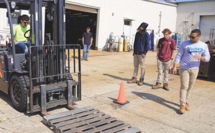 Nunez Instructor Jesús Melendez leads a forklift certi. cation class on the Nunez campus. Forklift is one of 8 equipment certi. cations and . ve workplace certi. cations available through Nunez's six-week Heavy Equipment program.